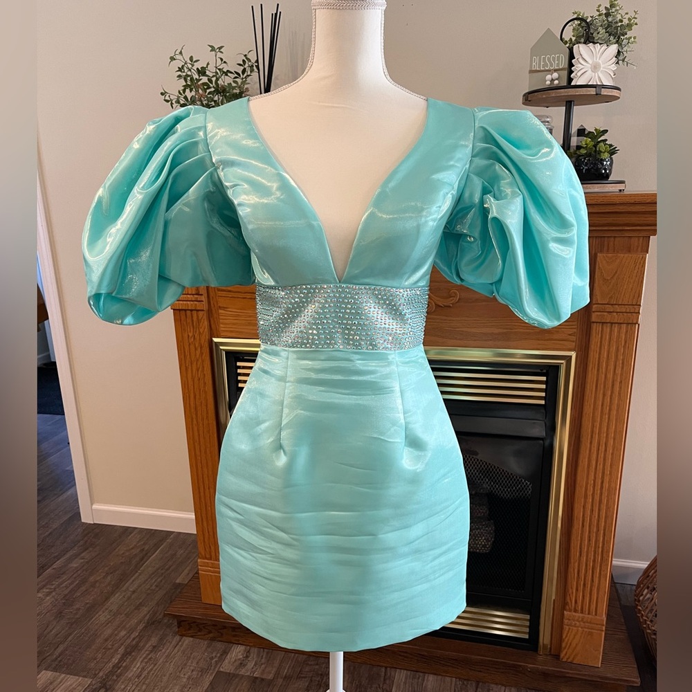 Ashley Lauren stain teal dress with iridescent accents. Worn once size 8